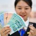 Asian Currencies Retreat as Chinese Data Points to Slower Growth