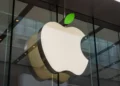 Apple shares decline due to lower projected December quarter revenue.