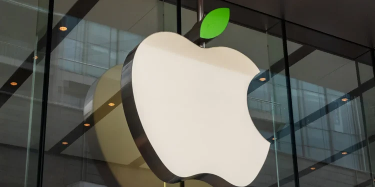 Apple shares decline due to lower projected December quarter revenue.